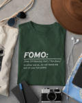 fomo-t-shirt-placed-between-some-accessories-