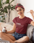 fomo-t-shirt-placed-between-some-accessories-