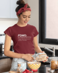 fomo-t-shirt-placed-between-some-accessories-